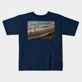 Dog walk by sea Kids T-Shirt